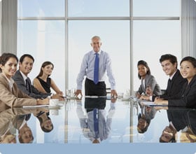Coworkers sitting together and smiling outside. Coworkers sitting together and smiling outside.